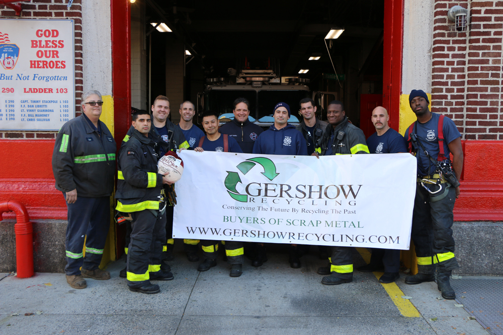 Eric Kugler (left), Manager, Gershow Recycling, poses with members of Ladder 103 “Pride of Sheffield Avenue” and one of the turkeys the fire department received from Gershow.