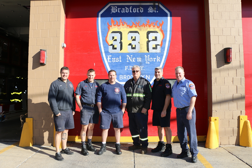 Eric Kugler (third from right), Manager, Gershow Recycling, poses with members of the FDNY’s Engine 332/Ladder 175, who received four turkeys from Gershow.