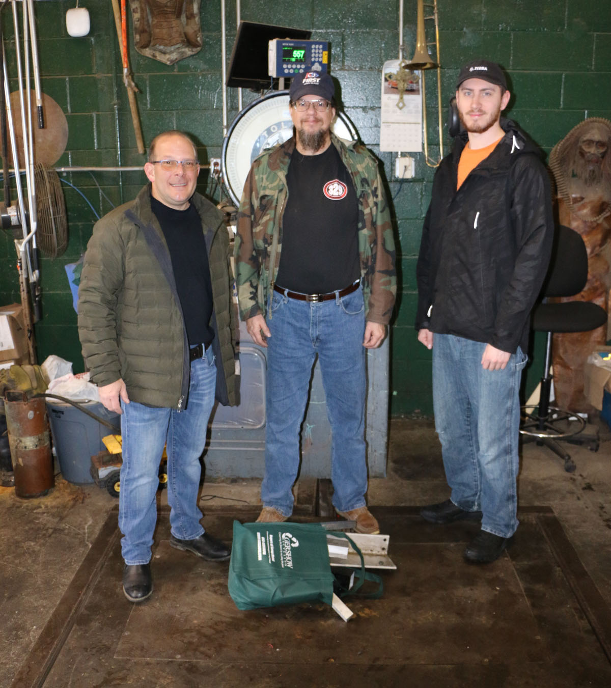 Gershow Manager Jonathan and Patchogue-Medford High School Robotics Team Mentors Roger Arnoldi and Matt Boehm.