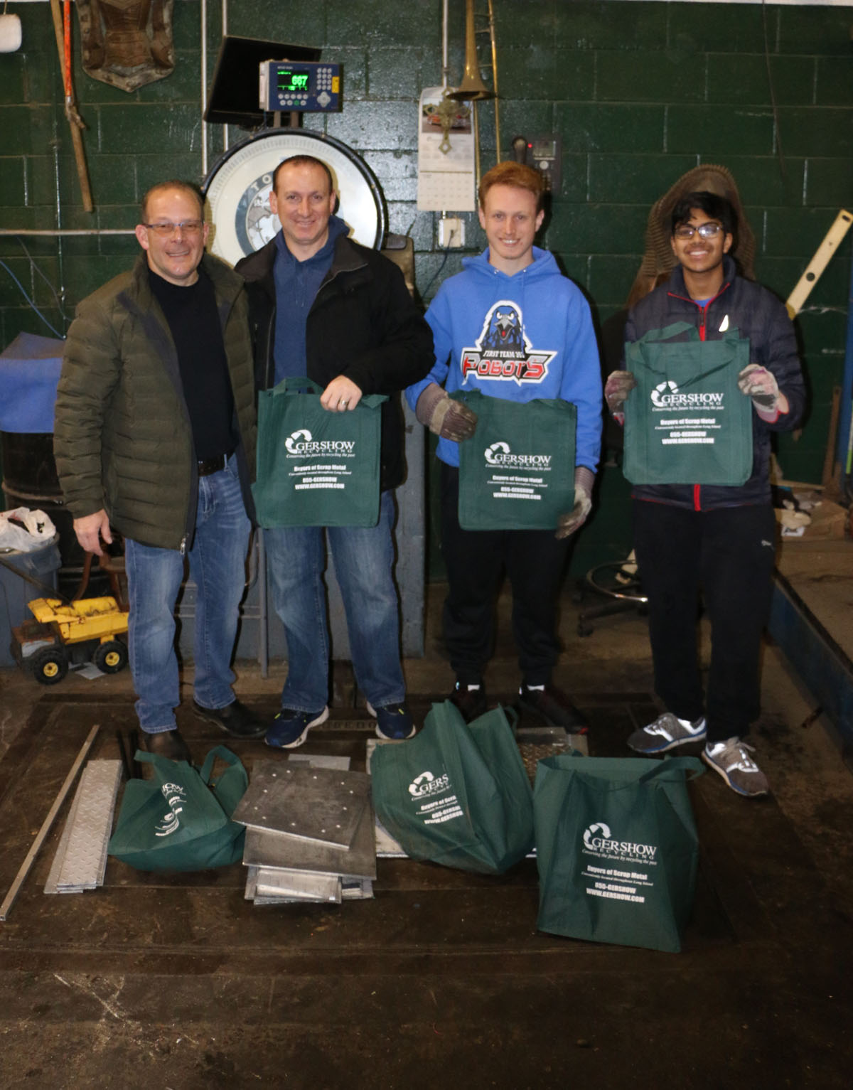 Gershow Manager Jonathan Abrams, Plainview-Old Bethpage Robotics Team Parent Brian Sackstein, Safety Captain Brandon Sackstein and Team Member Arnav Surjan.