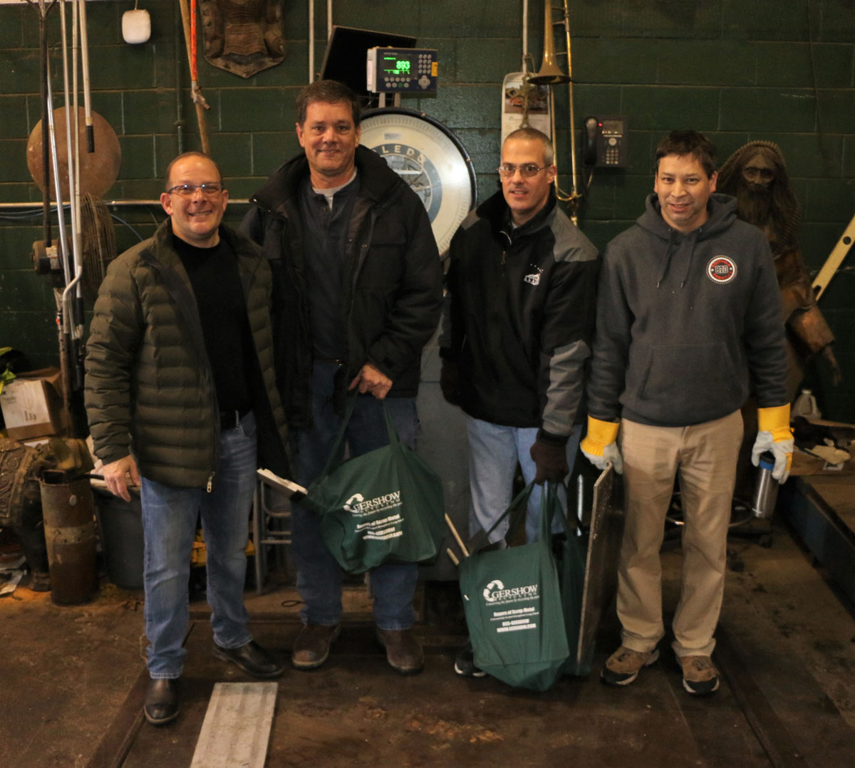 Gershow Manager Jonathan Abrams, Southold High School Robotics Team Coach Bob Gammon and Mentors Tom Schade and Ken Tiu.