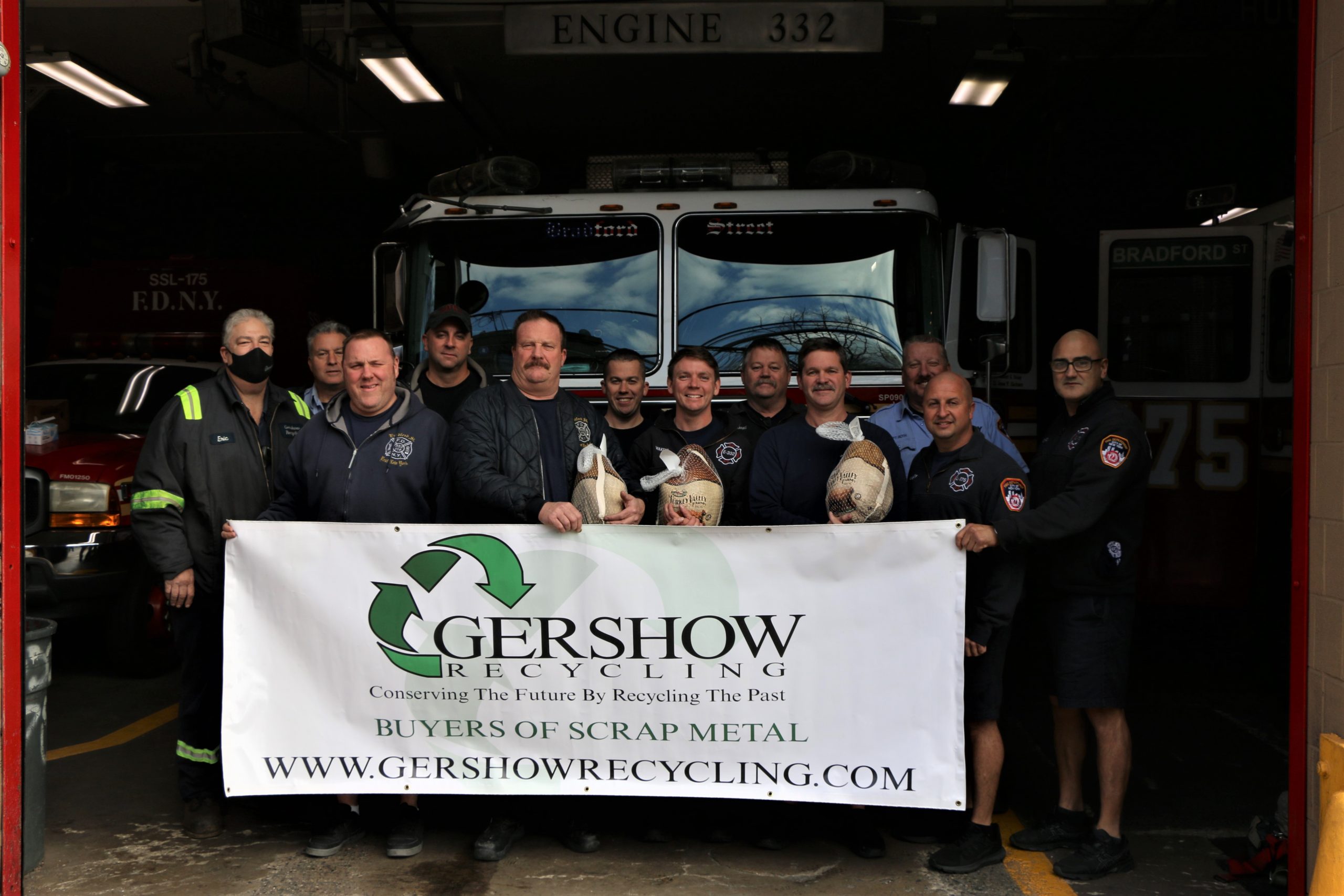 Eric Kugler (left), Manager, Gershow Recycling, presented turkeys to members of FDNY’s Engine 332/Ladder 175 at Bradford Street.